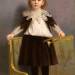 Portrait of a child standing on a settee